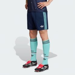 Spodenki wyjazdowe Niemcy 26. Niebieskie krótkie spodenki sportowe męskie Adidas, l, z aplikacjami, z materiału, do piłki nożnej, climacool (adidas). Za 263.83 zł.