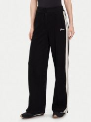 Guess Spodnie dresowe V5BB16 KCX52 Czarny Wide Leg. Czarne spodnie dresowe damskie Guess, m, z aplikacjami, z dresówki. Za 349.99 zł.