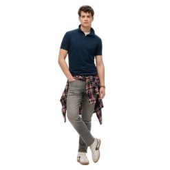 Koszulka polo z dżerseju Superdry Essential. Niebieskie koszulki polo męskie Superdry., na lato, m, bez wzorów, z dżerseju, bez ramiączek. W wyprzedaży za 193.50 zł.
