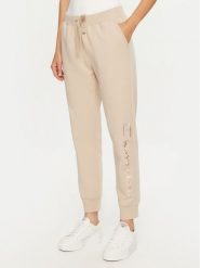 Champion Spodnie dresowe 117584 Beżowy Slim Fit. Brązowe spodnie dresowe damskie Champion, xl, bez wzorów, z bawełny. Za 159.99 zł.