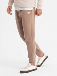 Klasyczne spodnie dresowe unisex ze ściągaczami brązowe V16 OU-PSBC-0100 M/L. Brązowe spodnie sportowe męskie Ombre, l, bez wzorów, z dresówki. Za 302.57 zł.