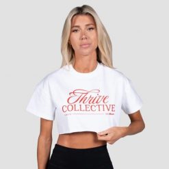 Koszulka damska fitness oversize biała Thrive Cropped. Białe koszulki sportowe damskie GYMBEAM, m, bez wzorów, z bawełny, bez kołnierzyka, bez ramiączek, na fitness i siłownię. Za 80.90 zł.