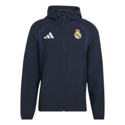 Kurtka przeciwwiatrowa z zamkiem Real Madrid Tiro 2026/27. Niebieskie kurtki męskie Adidas, l, bez wzorów, ze splotem, eleganckie, bez kaptura. Za 388.00 zł.