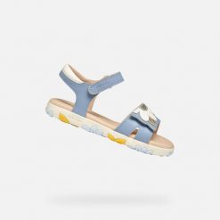 Sandały Geox Model J Sandal Haiti Girl Kolor Niebieski. Białe sandały damskie Geox, bez wzorów, z syntetyku, bez obcasa, bez zapięcia. Za 212.99 zł.