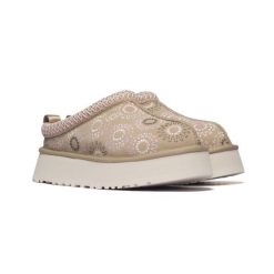 Damskie kapcie Ugg W TAZZ SUN STITCH 1178193-MDSD. Brązowe kapcie damskie UGG, bez wzorów, z gumy, z okrągłym noskiem. Za 519.00 zł.