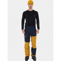 Spodnie Narciarskie Męskie Fundango Teak Colourblock. Niebieskie spodnie snowboardowe męskie Fundango, na zimę, m, bez wzorów, z materiału, narciarskie. Za 499.90 zł.