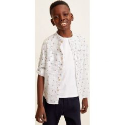 Mango Kids - Koszula dziecięca Damao4 110-164 cm. Białe koszule dla chłopców Mango Kids, bez wzorów, z bawełny, casualowe, bez kołnierzyka, bez ramiączek. W wyprzedaży za 29.90 zł.