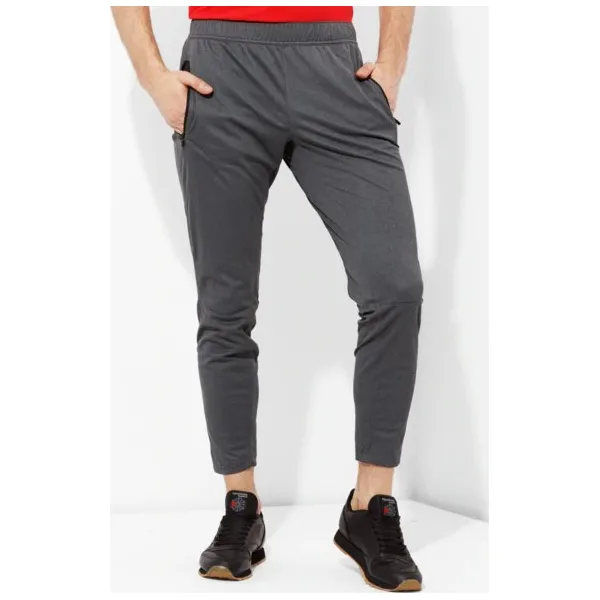 Reebok Spodnie Speedwick Knit Trackster , szary, rozmiar M. Szare spodnie sportowe męskie Reebok, l, bez wzorów, z dresówki. W wyprzedaży za 199.99 zł.