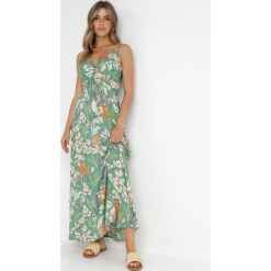 Zielona Sukienka Nerin. Zielone sukienki damskie Born2be, na plażę, l, bez wzorów, z tkaniny, boho, bez kołnierzyka, bez ramiączek, maxi, kopertowe. Za 84.99 zł.