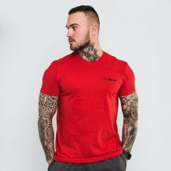 Koszulka męska fitness regular czerwona Basic. Czerwone koszulki sportowe męskie GYMBEAM, m, bez wzorów, z bawełny, bez kołnierzyka, bez ramiączek, na fitness i siłownię. Za 42.90 zł.