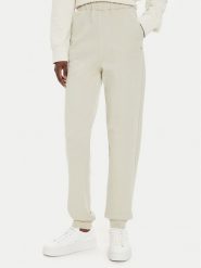 Calvin Klein Jeans Spodnie dresowe J20J224443 Beżowy Regular Fit. Brązowe spodnie dresowe damskie Calvin Klein Jeans, l, bez wzorów, z bawełny. Za 289.99 zł.