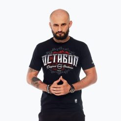 Koszulka męska Octagon Santa Muerte. Czarne koszulki sportowe męskie OCTAGON, l, bez wzorów, z bawełny, bez kołnierzyka, bez ramiączek, na fitness i siłownię. Za 89.99 zł.
