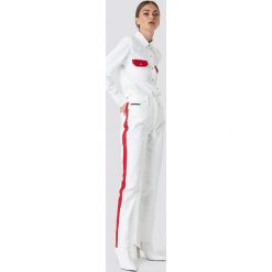 Calvin Klein Spodnie HR Straight Taped - White. Spodnie materiałowe damskie marki Calvin Klein. W wyprzedaży za 275.58 zł.