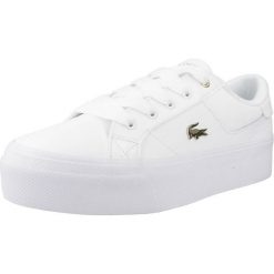 Tenisówki Lacoste Model Ziane Kolor Biały. Białe trampki i tenisówki damskie Lacoste, bez wzorów, z materiału, klasyczne, bez zapięcia. Za 389.00 zł.