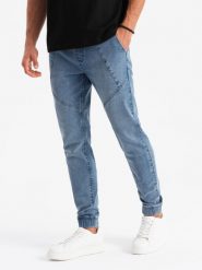 Męskie joggery jeansowe z asymetrycznymi przeszyciami – niebieskie V2 OM-PADJ-0165 - XL. Niebieskie spodnie materiałowe męskie Ombre Clothing, m, z aplikacjami, z bawełny, casualowe. Za 113.99 zł.