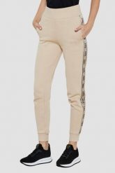GUESS Beżowe spodnie dresowe damskie Britney, Rozmiar S. Brązowe spodnie dresowe damskie Guess, s, z aplikacjami, z dresówki. W wyprzedaży za 284.99 zł.