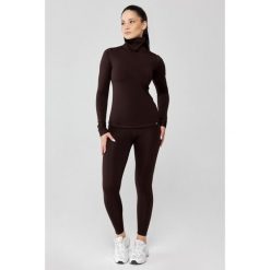 Damska bielizna termoaktywna z golfem Rough Radical Powder. Brązowa bielizna termoaktywna damska ROUGH RADICAL, bez wzorów, bez ramiączek. Za 229.00 zł.