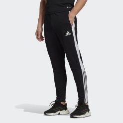 Spodnie adidas Tiro Essential, Mężczyźni. Czarne spodnie sportowe męskie Adidas, m, bez wzorów, z dresówki, do piłki nożnej. Za 120.00 zł.