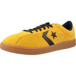 Buty CONVERSE ALL STAR CLASSIC TRAINER SUEDE Żółty. Żółte trampki męskie Converse, bez wzorów, z tkaniny, retro, bez zapięcia. Za 275.99 zł.