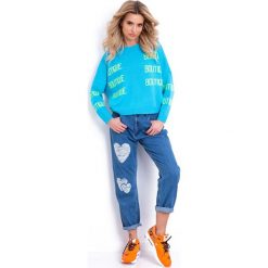 Niebieski Nierozpinany Luźny Sweter z Napisami. Swetry damskie marki Molly.pl. Za 118.90 zł.