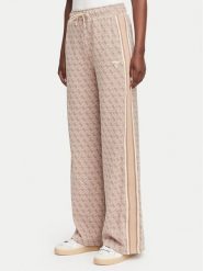 Guess Spodnie dresowe V6YB27 K5181 Beżowy Relaxed Fit. Brązowe spodnie dresowe damskie Guess, xs, z aplikacjami, z dresówki. Za 474.99 zł.
