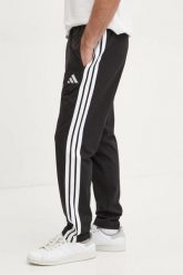 Spodnie dresowe adidas Essentials 3-Stripes Single. Czarne spodnie sportowe męskie Adidas, s, bez wzorów, z dresówki, na fitness i siłownię. Za 212.00 zł.