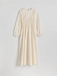 Sukienka z dekoracyjnymi falbanami - kremowy. Białe sukienki damskie Reserved, l, bez wzorów, z bawełny, bez kołnierzyka, bez ramiączek, midi. W wyprzedaży za 179.99 zł.