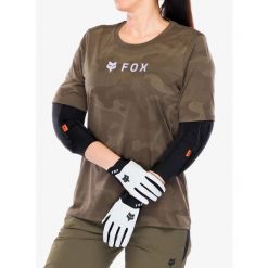 Koszulka rowerowa damska Fox Ranger Tru Dri SS Jersey. Brązowe koszulki sportowe damskie FOX, bez wzorów, z jersey, bez kołnierzyka, bez ramiączek, rowerowe. Za 208.99 zł.