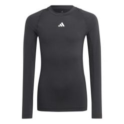 Koszulka adidas Tech Fit Jr. Czarna, dopasowana, z długim rękawem. Czarne koszulki sportowe damskie Adidas, bez wzorów, z elastanu, bez kołnierzyka, bez ramiączek, na fitness i siłownię, techfit (adidas). Za 81.00 zł.