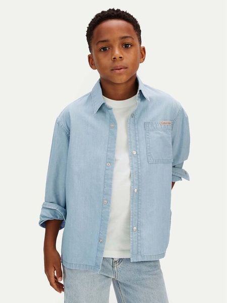 Calvin Klein Koszula jeansowa LVCKSJB30B Niebieski Regular Fit. Niebieskie koszule dla chłopców Calvin Klein, bez wzorów, z bawełny, bez kołnierzyka, bez ramiączek. Za 249.99 zł.