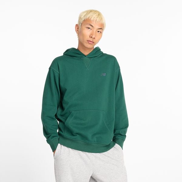Bluza męska New Balance MT41534NWG – zielona. Zielone bluzy męskie New Balance, m, bez wzorów, z materiału, z kapturem. Za 199.99 zł.