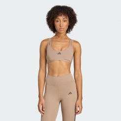 Biustonosz Aeroimpact Luxe Training Light-Support. Brązowe obuwie sportowe damskie Adidas, bez wzorów, z materiału, na fitness i siłownię. W wyprzedaży za 142.35 zł.