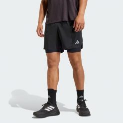 Shorty adi365 Running Essentials 2w1. Białe buty sportowe męskie Adidas, bez wzorów, do biegania. Za 179.00 zł.