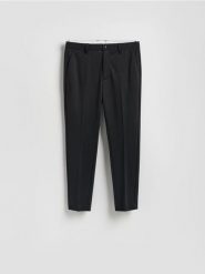 Spodnie chino slim fit - czarny. Czarne spodnie materiałowe męskie Reserved, l, bez wzorów, z dzianiny. Za 139.99 zł.