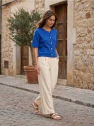 Kardigan z krótkim rękawem - niebieski. Niebieskie kardigany damskie Sinsay, l, bez wzorów, krótkie. W wyprzedaży za 29.99 zł.