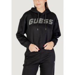 Bluza Kobieta GUESS ACTIVE PRIMULA RHINESTONES HOODIE SWE. Czarne bluzy damskie Guess Active, z aplikacjami, z bawełny, bez kaptura. W wyprzedaży za 339.60 zł.
