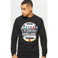 Bluza z grafiką - Czarny. Bluzy męskie marki KALENJI. W wyprzedaży za 39.99 zł.