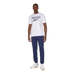 Spodnie dresowe Reebok Andre długie navy, polarowe, z ściągaczami i sznurkiem. Niebieskie spodnie dresowe damskie Reebok, l, bez wzorów, z dresówki. Za 202.80 zł.