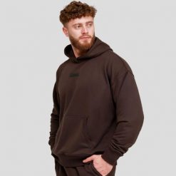 Bluza męska fitness z kapturem oversize brązowa Unstoppable. Brązowe bluzy sportowe męskie GYMBEAM, m, bez wzorów, z bawełny, z kapturem, na fitness i siłownię. Za 118.90 zł.