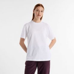 Koszulka damska New Balance WT41501WT – biała. Białe koszulki sportowe damskie New Balance, s, bez wzorów, z materiału, eleganckie, bez kołnierzyka. Za 169.99 zł.