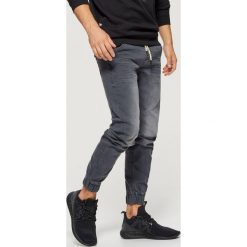 Jeansy SLIM JOGGER - Szary. Jeansy męskie marki Giacomo Conti. Za 119.99 zł.