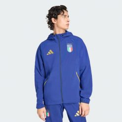 Wiatrówka Italy Tiro Travel Full Zip. Niebieskie kurtki męskie Adidas, bez wzorów, sportowe, bez kaptura. Za 399.00 zł.