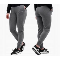 Damskie spodnie dresowe Nike Park 20 Fleece grafitowe. Białe spodnie dresowe damskie Nike, bez wzorów, z bawełny. Za 154.99 zł.