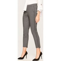 Eleganckie spodnie we wzory - Czarny. Spodnie materiałowe damskie marki Reserved. Za 119.99 zł.