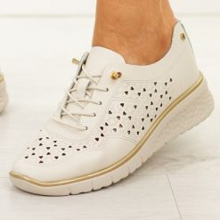 Beżowe skórzane ażurowe półbuty damskie Filippo Dp6714/26. Brązowe półbuty damskie Filippo, na jesień, w ażurowe wzory, z jeansu, z okrągłym noskiem, bez obcasa, na koturnie, bez zapięcia. W wyprzedaży za 192.72 zł.