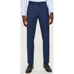 Spodnie garniturowe slim fit - Granatowy. Niebieskie eleganckie spodnie męskie Reserved. Za 129.99 zł.