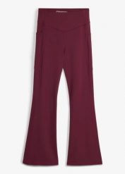 Wygodne legginsy sportowe z kieszonką na telefon i poszerzanymi nogawkami, z szybkoschnącego materiału. Czarne legginsy damskie bonprix, bez wzorów, z materiału. Za 124.99 zł.