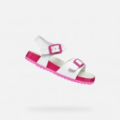 Sandały Geox Model J Adriel Girl Kolor Biały. Białe sandały damskie Geox, bez wzorów, z syntetyku, bez obcasa, bez zapięcia. Za 197.40 zł.