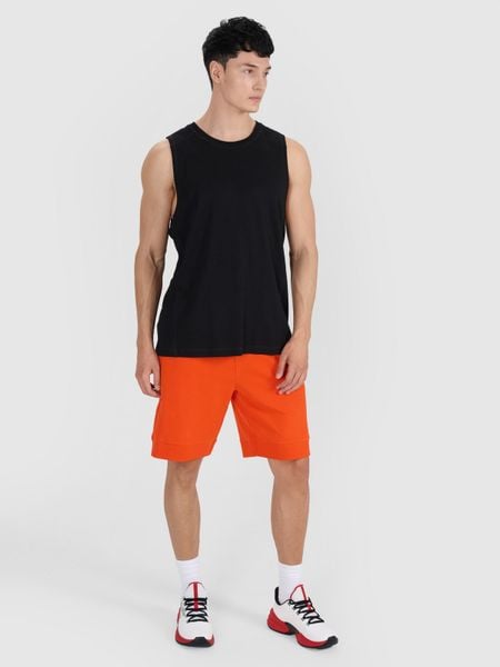 4F Tank top oversize męski - czarny XL. Czarne koszulki sportowe męskie 4f, m, bez wzorów, z bawełny, bez kołnierzyka, bez ramiączek, do koszykówki. Za 49.99 zł.