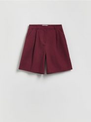 Bermudy w kant z dodatkiem lnu - burgundowy. Czerwone szorty damskie Reserved, l, bez wzorów, z jeansu. W wyprzedaży za 99.99 zł.